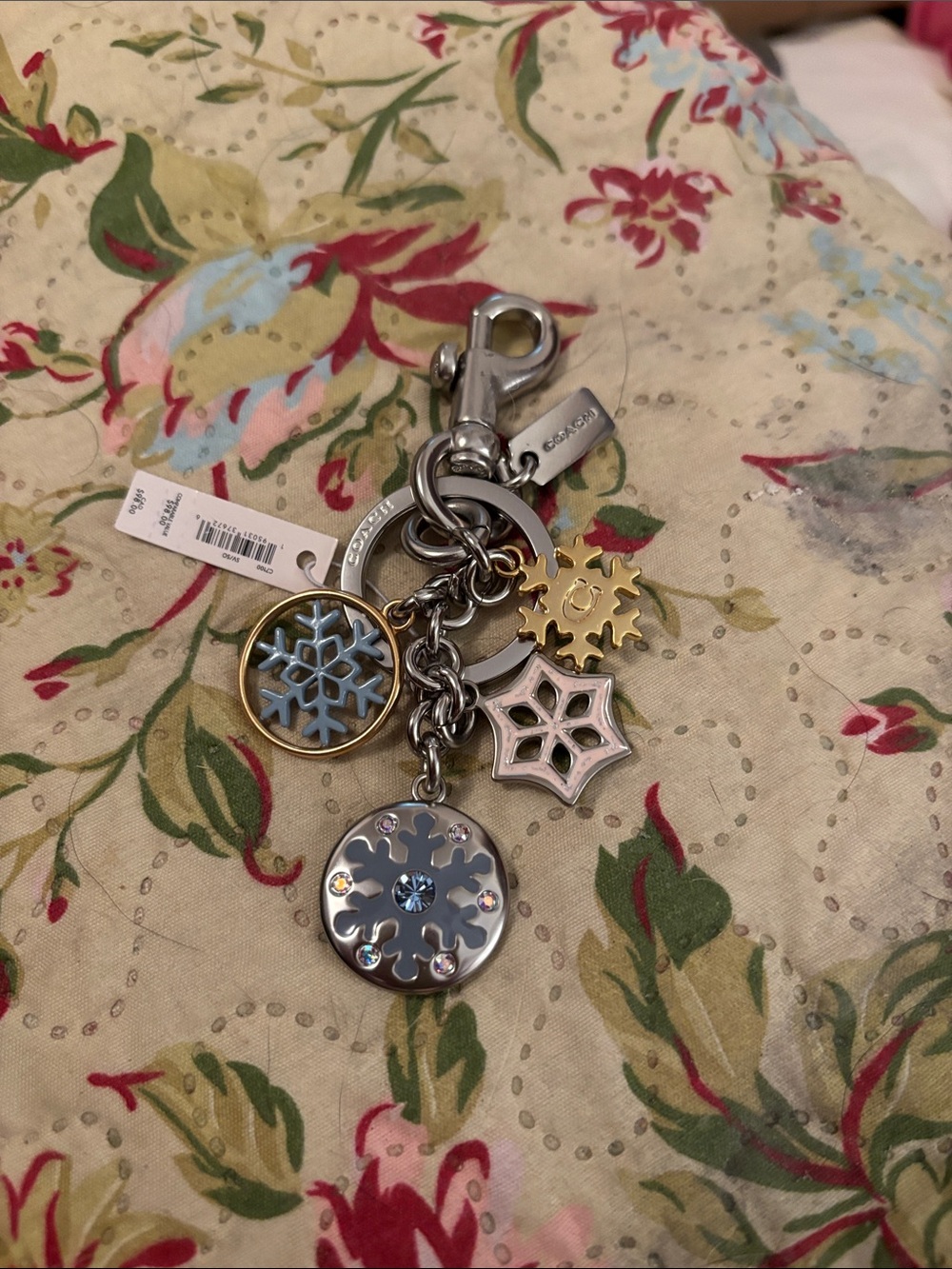 Coach Silver and Gold Snowflake Charm Keychain with Light Blue Accents